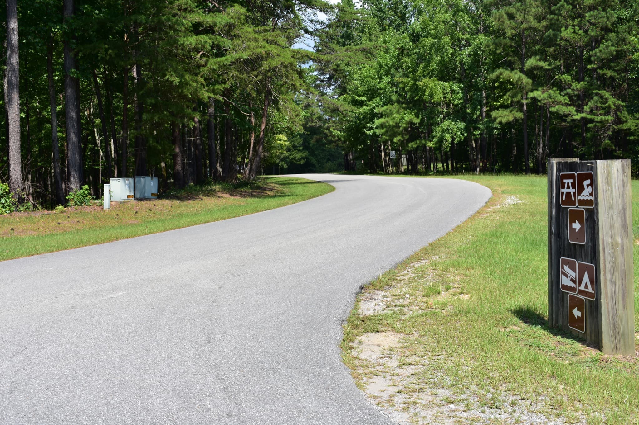 Campground road and direction sign at Clear Creek