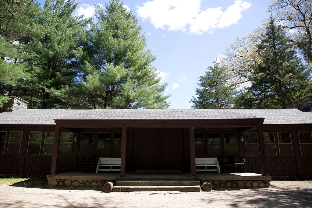 Benches on the long covered porch of the lodge