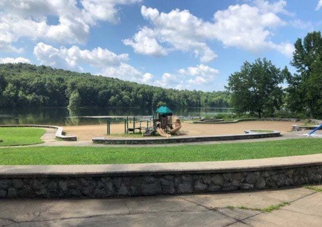 Swimming beach and playground on Tipsaw Lake